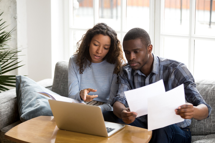 Couple discussing Maryland Estate Tax documents