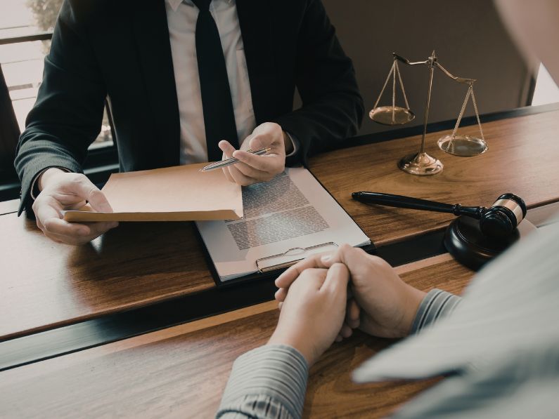 Estate planning attorney reviewing essential documents with Washington DC clients during a consultation